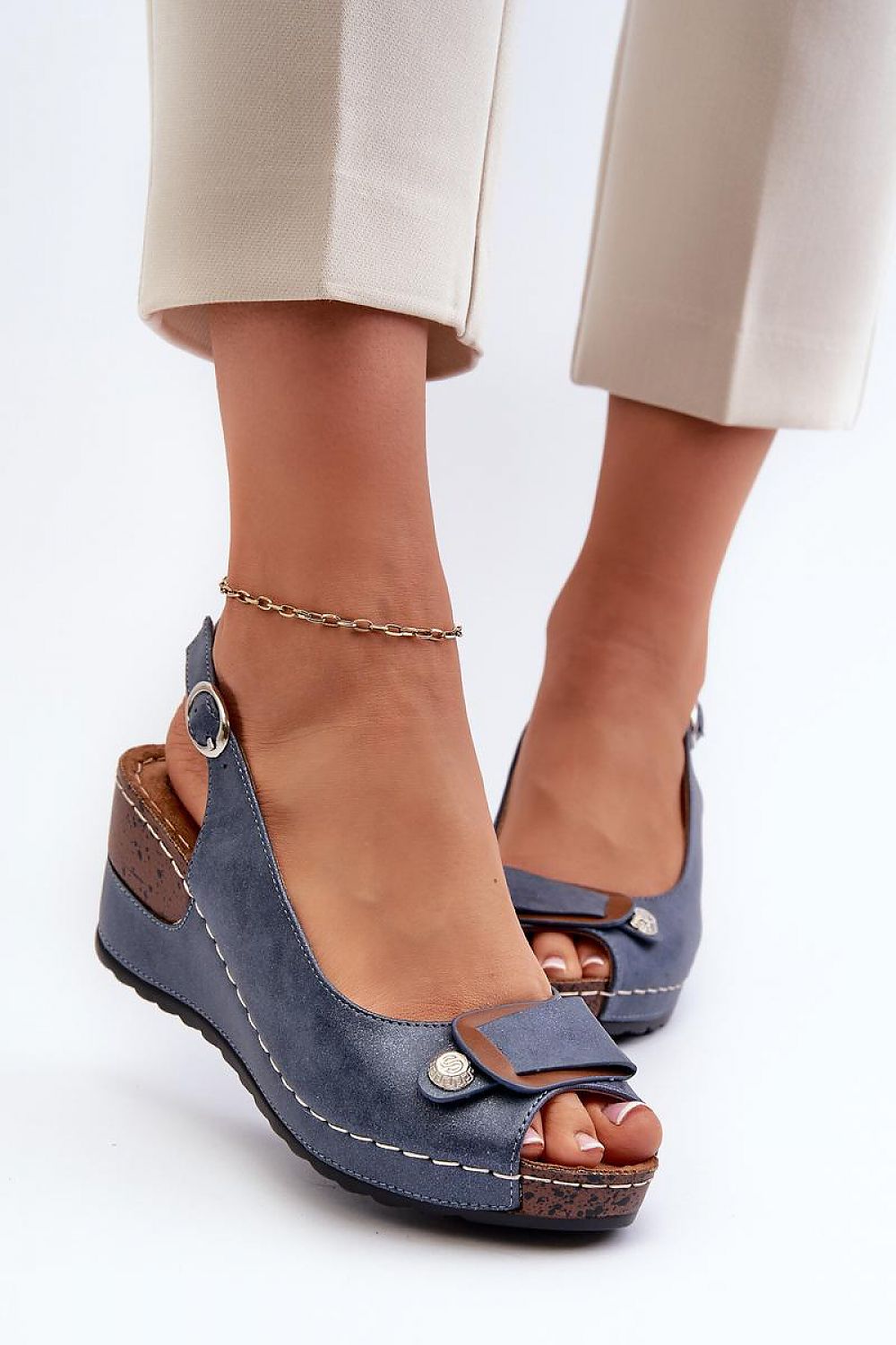 Woman wearing Vesmira Lifted Comfort Wedges with eco leather straps and cushioned suede insole, ideal for stylish comfort.