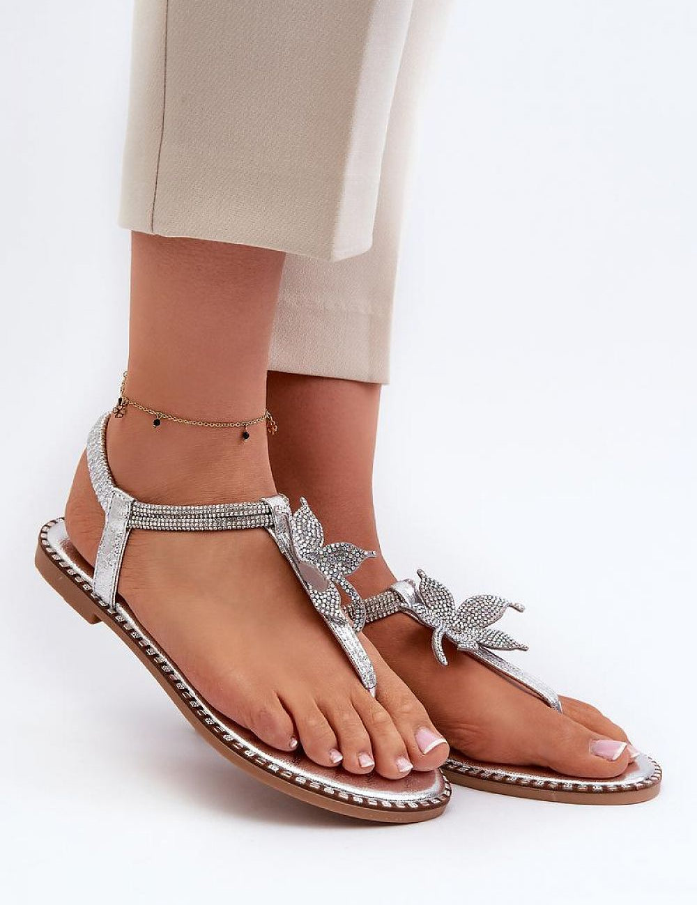 Woman wearing Elavie Blossom Accent Flats with floral design, soft synthetic finish, perfect for summer elegance and comfort.