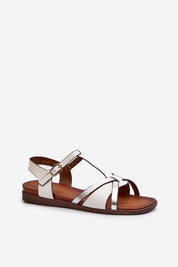 Delvene Buckled Flat Sandals in white artificial leather, featuring an adjustable strap and flat heel for summer elegance.
