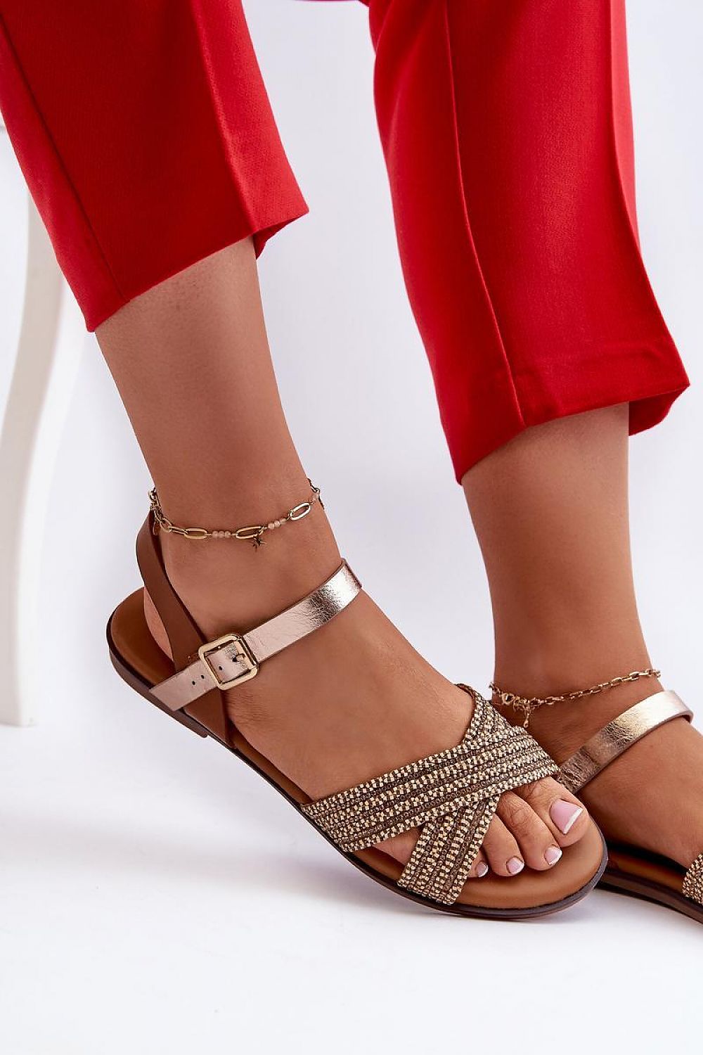 Serelvia Minimal Strap Sandals in eco leather with adjustable buckle, sleek design, ideal for summer wear, paired with red pants.
