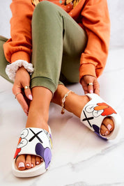 Woman wearing Mifla Cartoon Rubber Summer Slides with vibrant design, showcasing playful comfort and style on a marble floor.