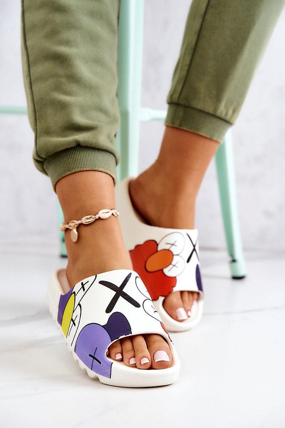 Woman wearing Mifla Cartoon Rubber Summer Slides with vibrant cartoon design and durable platform sole, perfect for playful comfort.
