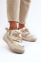 Velenta modern platform sneakers in beige, featuring smooth artificial leather uppers, worn with casual pants for a stylish look.