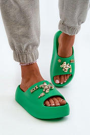 Green Floriva Thick-Sole Foam Flip-Flops with decorative accents, featuring a 5.5 cm platform. Ideal for stylish comfort and summer outings.