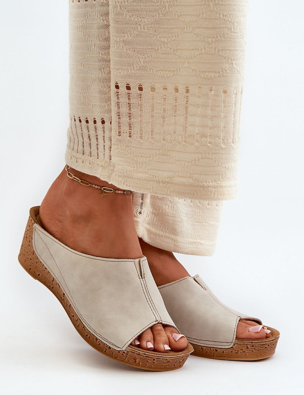Woman wearing Solenca Soft Arch Flip-Flops with wedge, showcasing casual suede elegance and comfort.