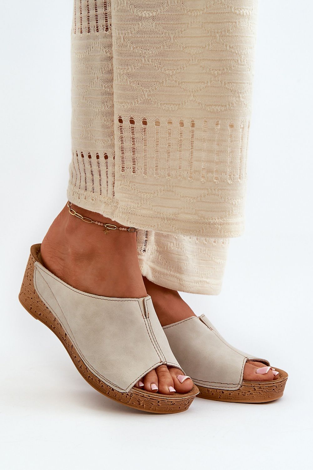 Woman wearing Solenca Soft Arch Flip-Flops with wedge, showcasing casual suede elegance and comfort.