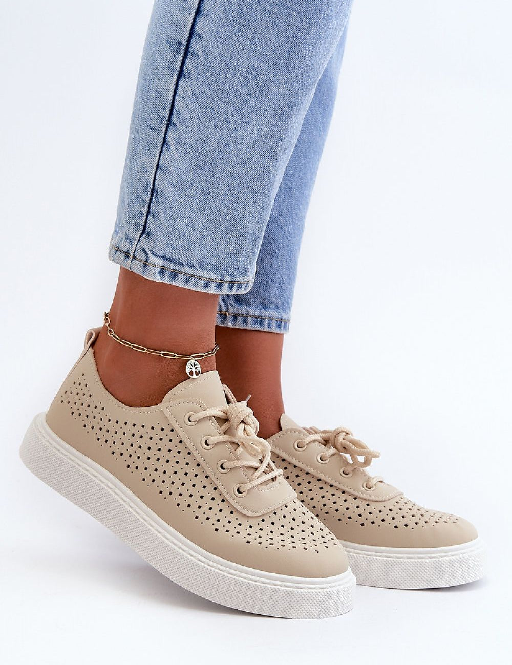 Ferossa Openwork Platform Sneakers in beige, worn with light denim jeans, showcasing perforated design and cushioned insole for comfort.