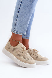 Ferossa Openwork Platform Sneakers in beige, worn with light denim jeans, showcasing perforated design and cushioned insole for comfort.