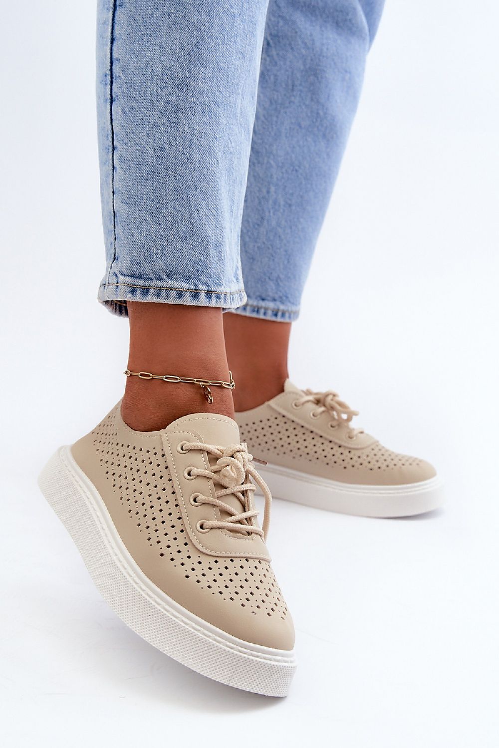 Beige Ferossa Openwork Platform Sneakers with blue jeans, featuring breathable design and cushioned comfort for summer.