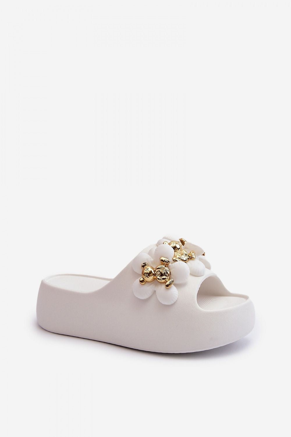 White platform flip-flop with decorative embellishments and thick sole, ideal for casual summer wear and beach outings.