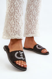 Model wearing Naerelle Suede Spark Flip-Flops with sequined straps, showcasing soft imitation suede and a low-profile heel.