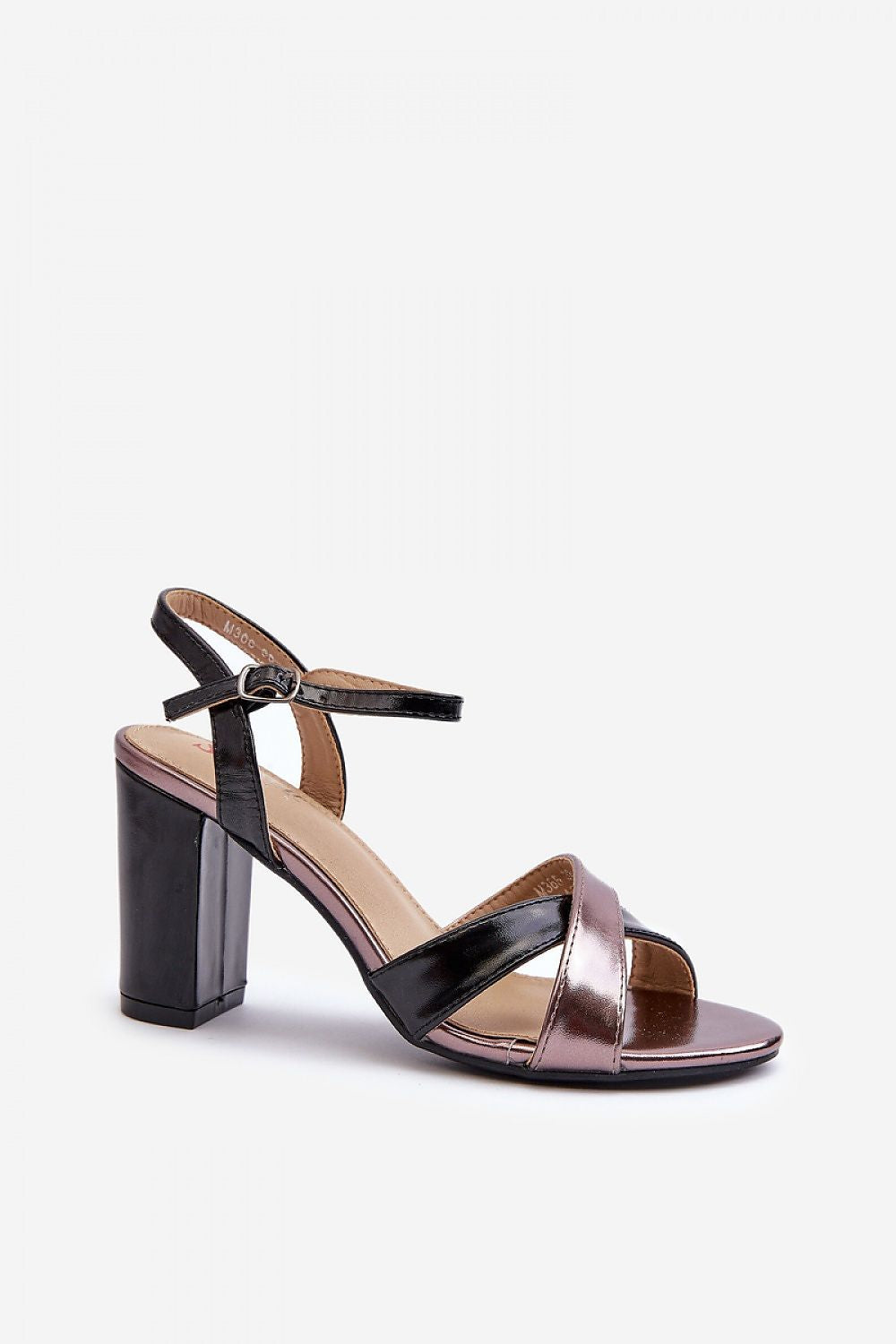 Rivella Cross-Strap Heeled Sandals in eco leather with intertwining straps and stiletto heel, featuring adjustable buckle for secure fit