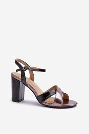 Rivella Cross-Strap Heeled Sandals in eco leather with intertwining straps and stiletto heel, featuring adjustable buckle for secure fit