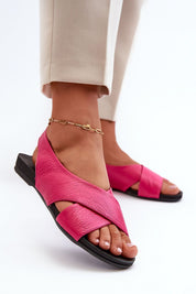 Woman wearing Talmea Soft-Strap Leather Sandals in pink, showcasing open heel and toe design for breathable comfort and style.