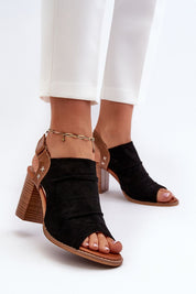Veliera Suede-Cutout Sandals with eco-suede, high heels, airy cutout design, and velcro closure, worn with white pants.