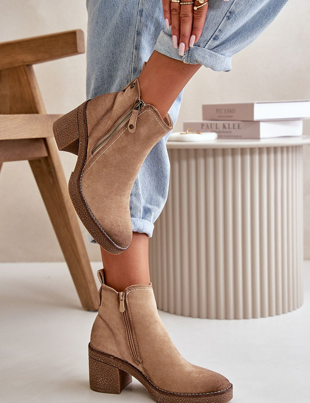 Woman wearing Sylmara Hearthstep suede ankle boots with block heel and side zipper, ideal for autumn and winter fashion.