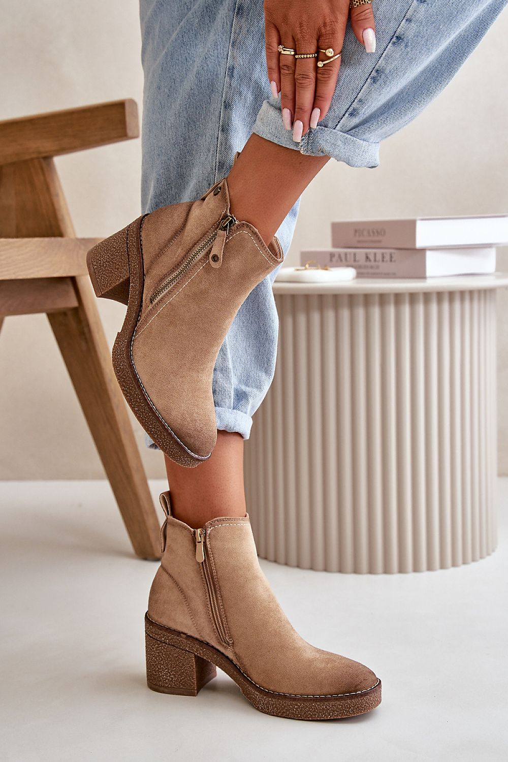 Woman wearing Sylmara Hearthstep suede ankle boots with block heel and side zipper, ideal for autumn and winter fashion.