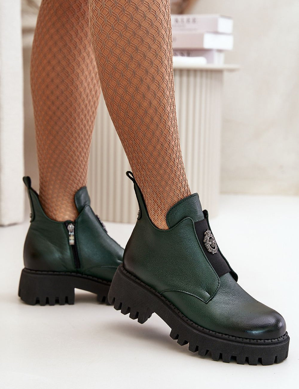 Virelsa Cresthold Leather Form ankle boots with chunky heel, grooved platform, and sculptural embellishment for stylish elevation.