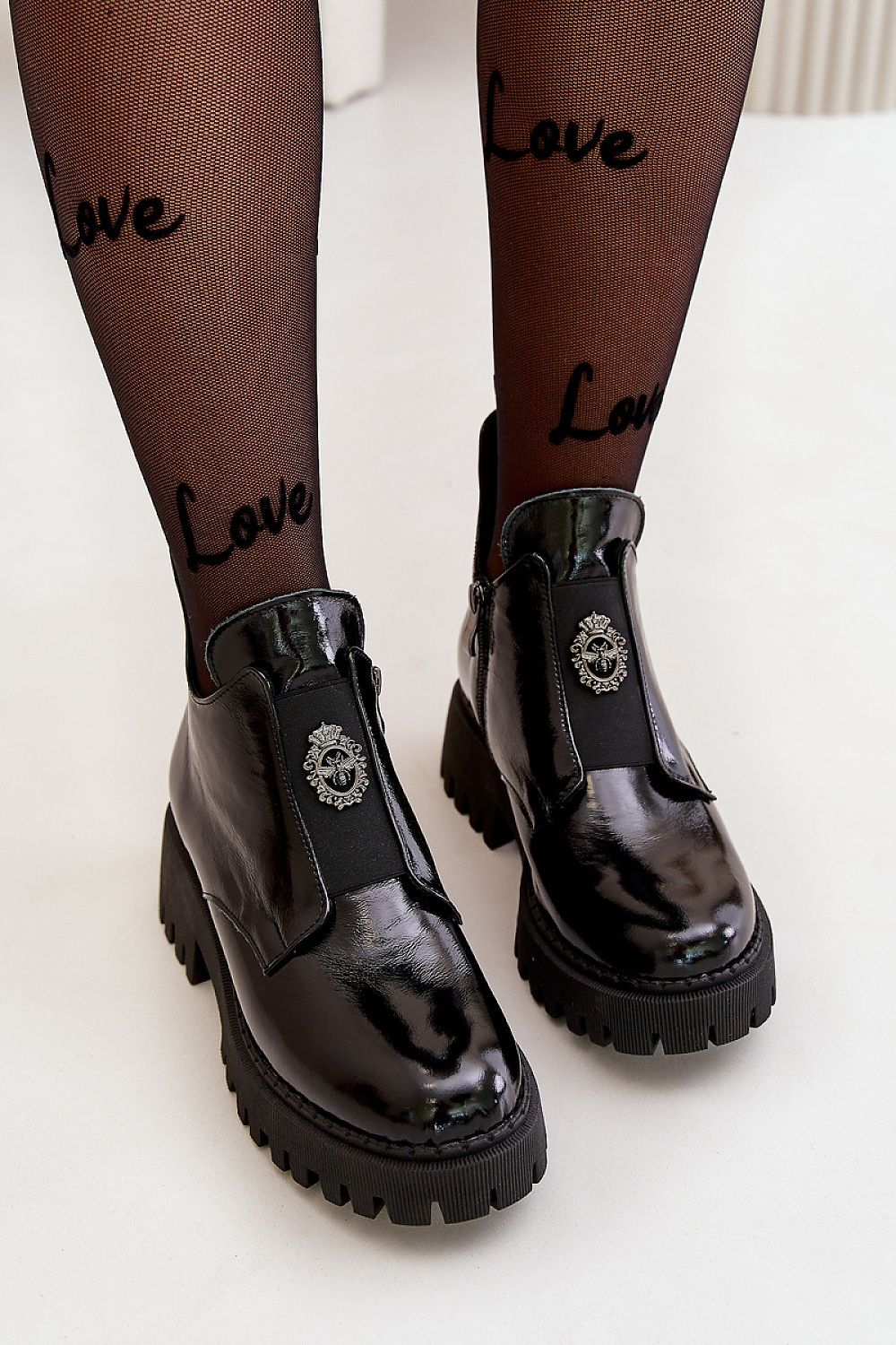 Virelsa Cresthold Leather Form ankle boots with chunky heel and platform, featuring sculptural embellishment and elastic insert.