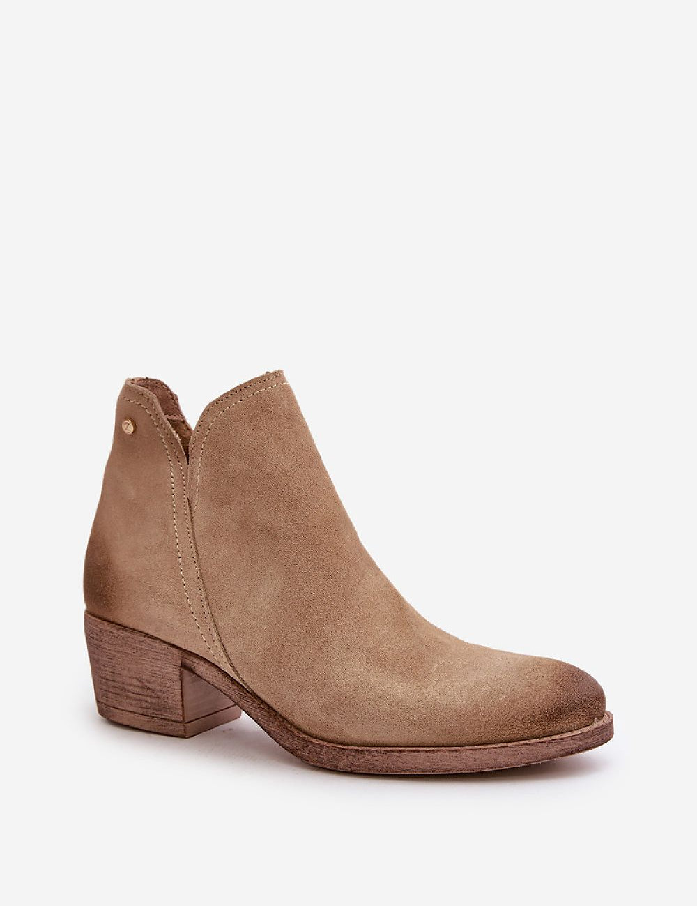 Natural suede ankle boot with cutout design, mid-height heel, rounded toe, and side zipper for easy closure. Perfect for cool-season wear.