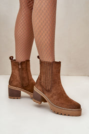 Women's Aurevyn Hollowrise suede-finish ankle boots with block heels, rounded toe, and side zipper, shown in a warm brown color.