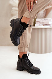 Narella Softcord Urban Base ankle boots in black eco leather with lacing and side zipper, styled with beige pants.