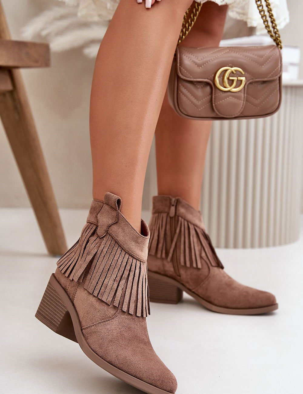 Stylish eco suede ankle boots with fringe detailing and stiletto heel, perfect for autumn-winter fashion.