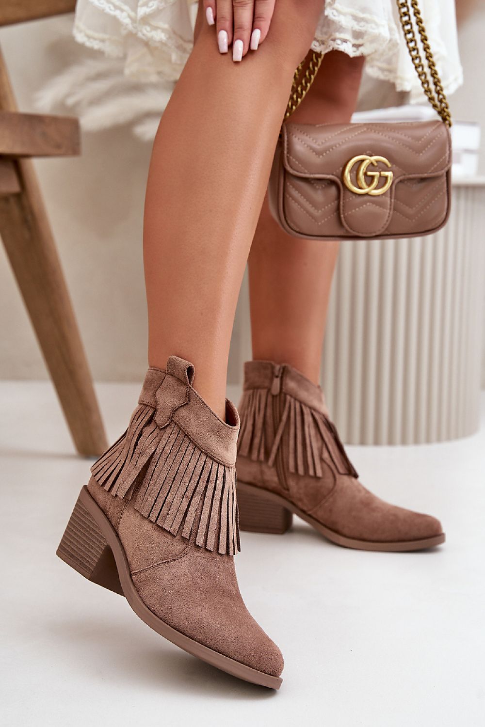 Stylish eco suede ankle boots with fringe detailing and stiletto heel, perfect for autumn-winter fashion.