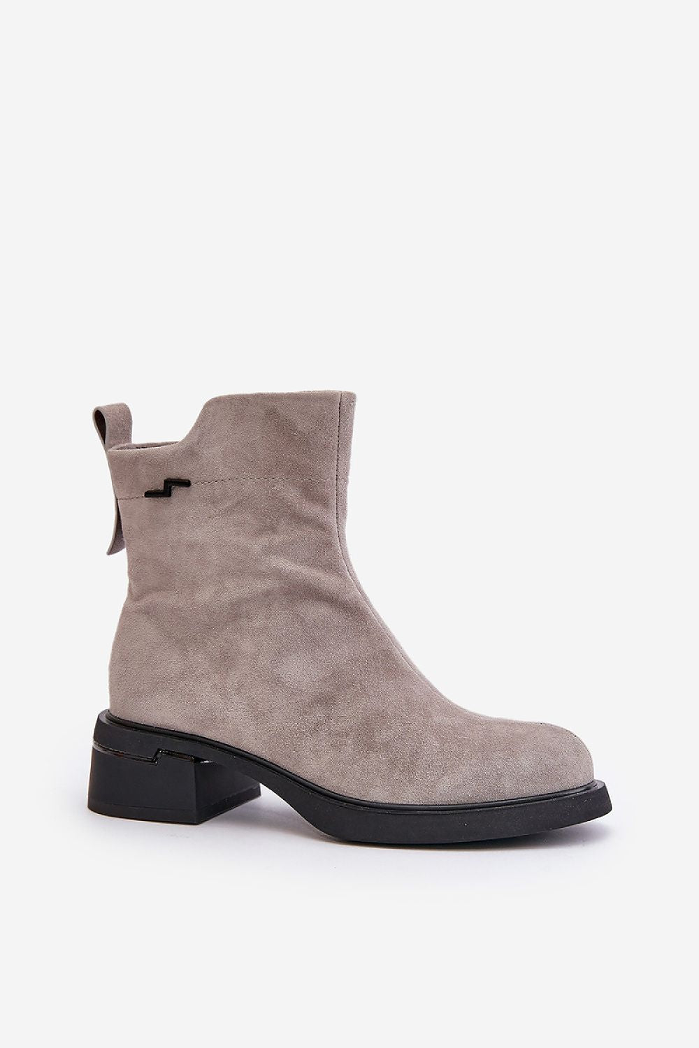 Veralla suede zippered ankle boots with rounded toes, subtle stitching, and medium heel for stylish comfort.