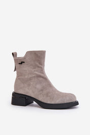 Veralla suede zippered ankle boots with rounded toes, subtle stitching, and medium heel for stylish comfort.