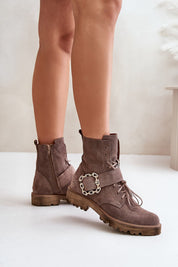 Bravura suede ankle boots with buckle, flat sole, and side zipper, offering durability and style for all-day comfort.