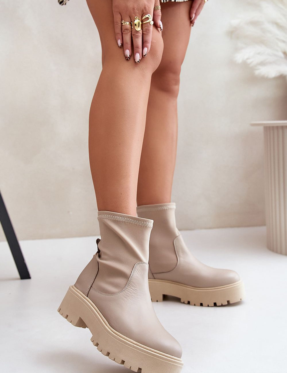 Venire Leather Platform Pull-On Boots in beige, ankle-high silhouette, genuine leather, flat heel, and platform, worn by a model.