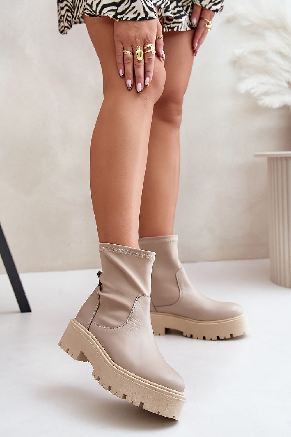 Venire Leather Platform Pull-On Boots in beige, ankle-high silhouette, genuine leather, flat heel, and platform, worn by a model.