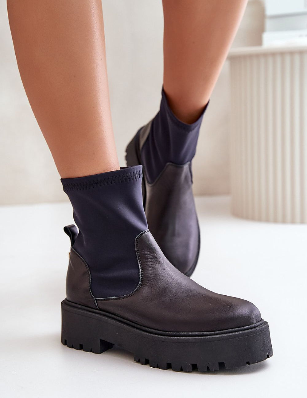 Venire Leather Platform Pull-On Boots in black leather with ankle-high silhouette and flat heel, ideal for casual or tailored outfits.