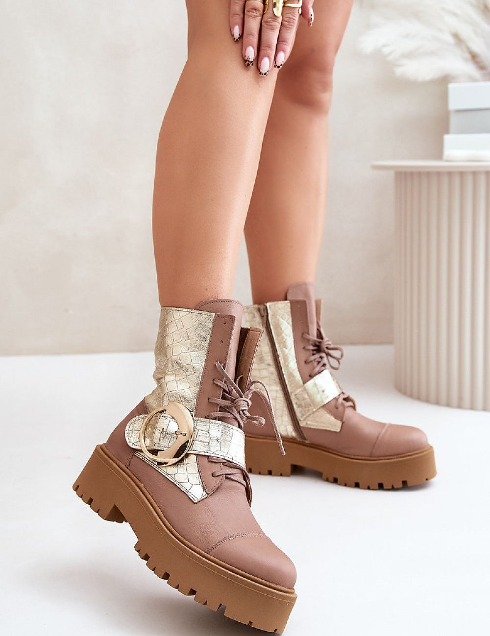 Bravora leather buckled platform boots with large buckle and lace-up front, featuring sturdy platform and stylish design