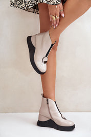 Alt Tag: Woman wearing Bravina Platform Ankle Boots in sleek eco leather with side zipper and ornamental detail, showing platform sole.