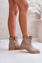 Valdera suede ankle boots with cutout detail, flat heel, side zipper, and rounded toes, perfect for casual elegance.