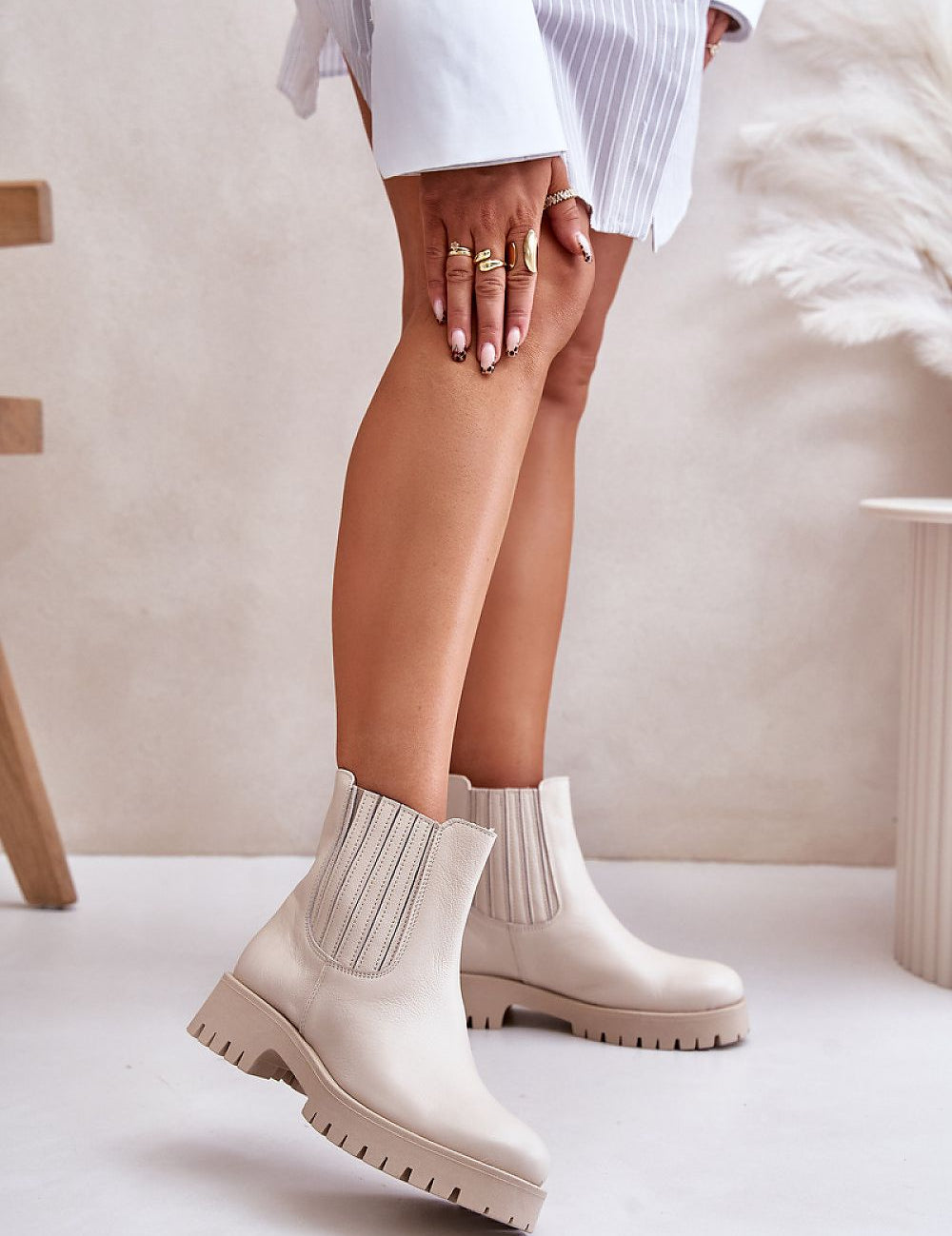 Woman wearing beige Myrella Platform-Laced Winter Boots with eco leather, block heel, and secure fit, styled for fall and winter.