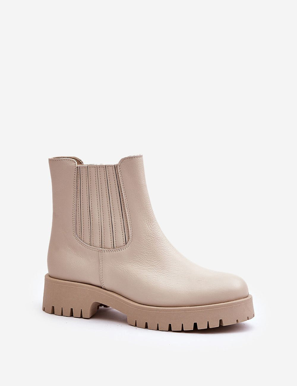Beige eco leather ankle boots with chunky sole and elastic side panels for easy slip-on, perfect for versatile fall and winter style.
