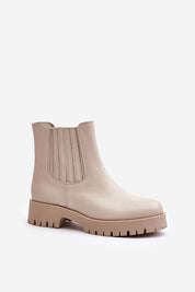 Beige eco leather ankle boots with chunky sole and elastic side panels for easy slip-on, perfect for versatile fall and winter style.