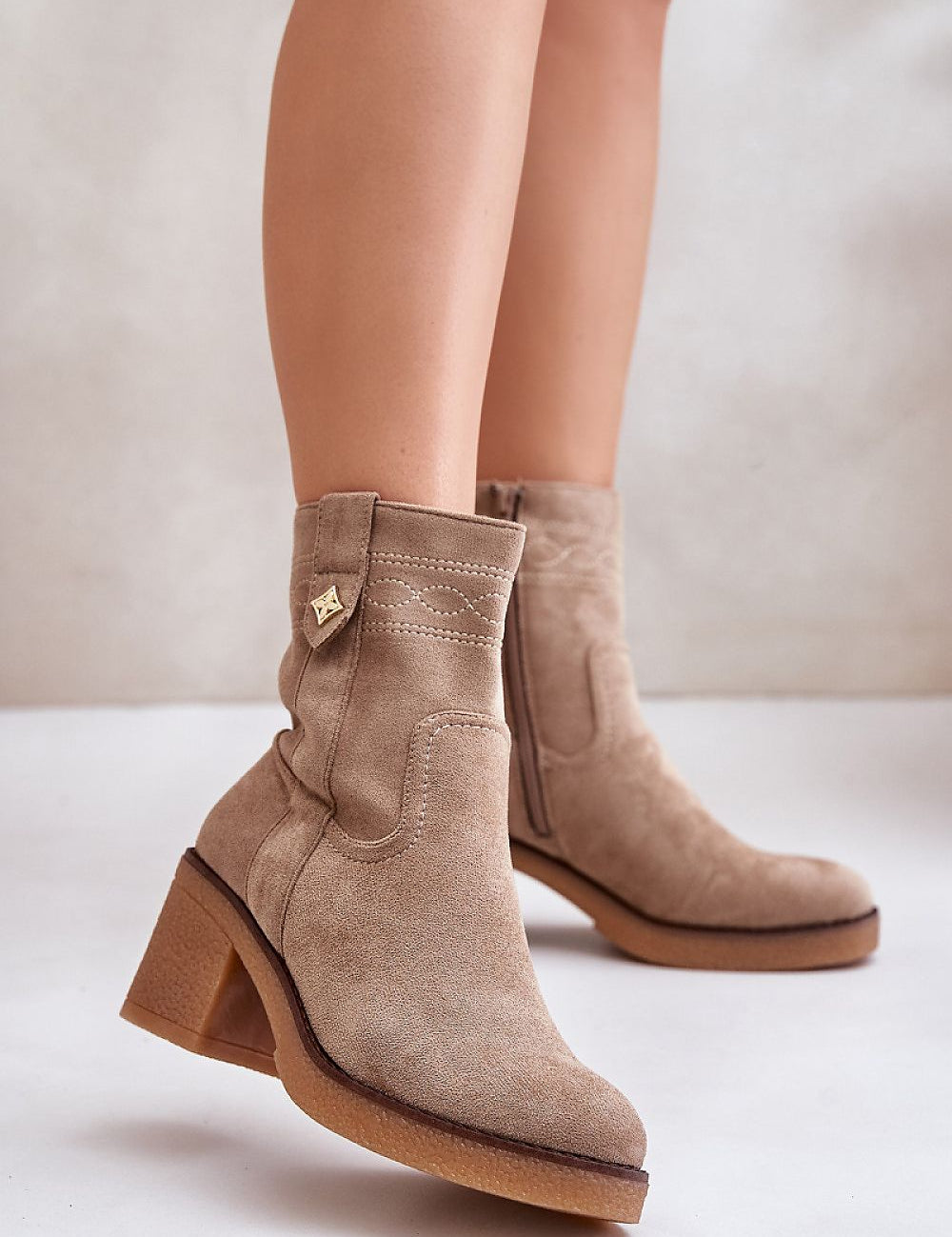 Evirenna boots in eco-suede with block heel, stitched accents, and warm lining, perfect for winter elegance and comfort.