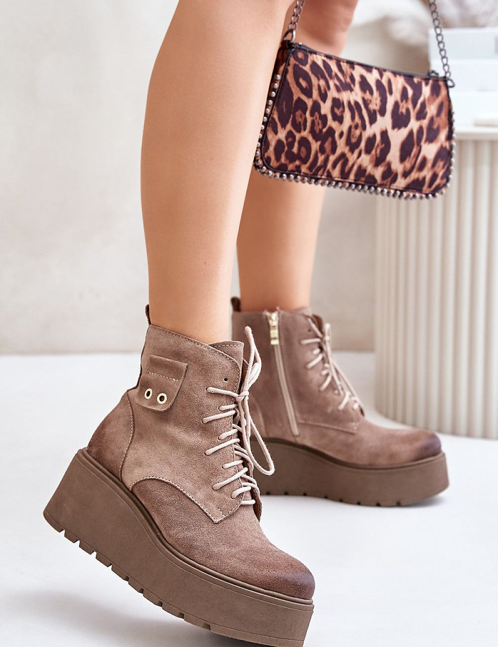 Tharvene Ridgewarm Sculpted Ease ankle boots with high wedge and side zipper, crafted from natural leather for warmth and style.