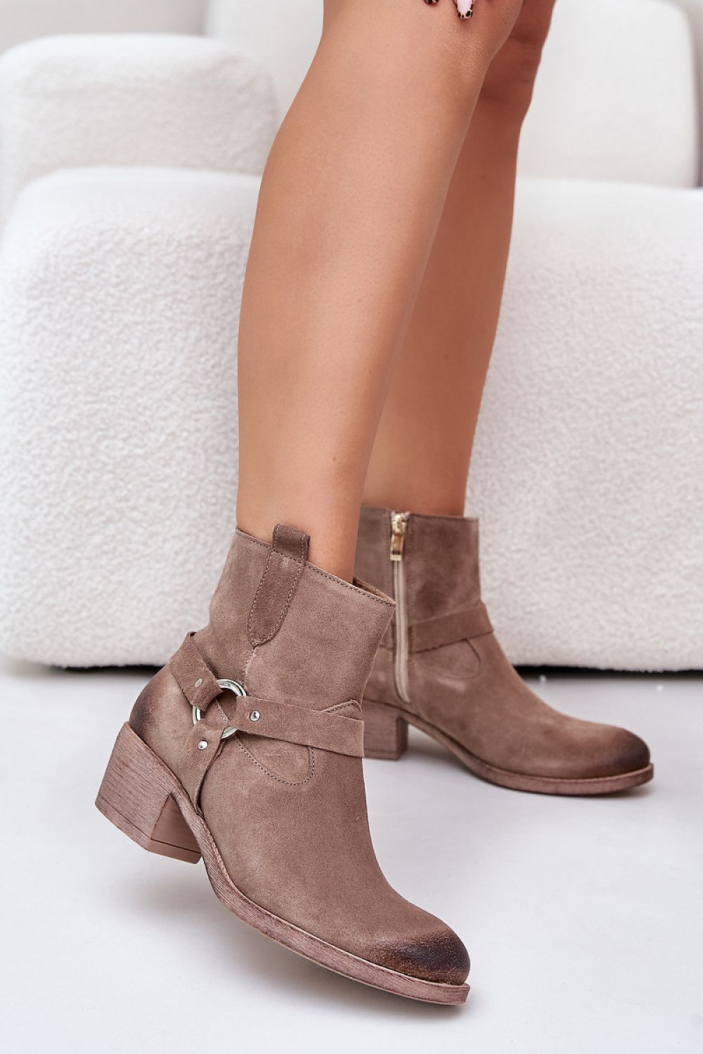 Eranise Suede Cold-Weather Boots with low heel and stitched suede stripes, perfect for cool days.”}]}.