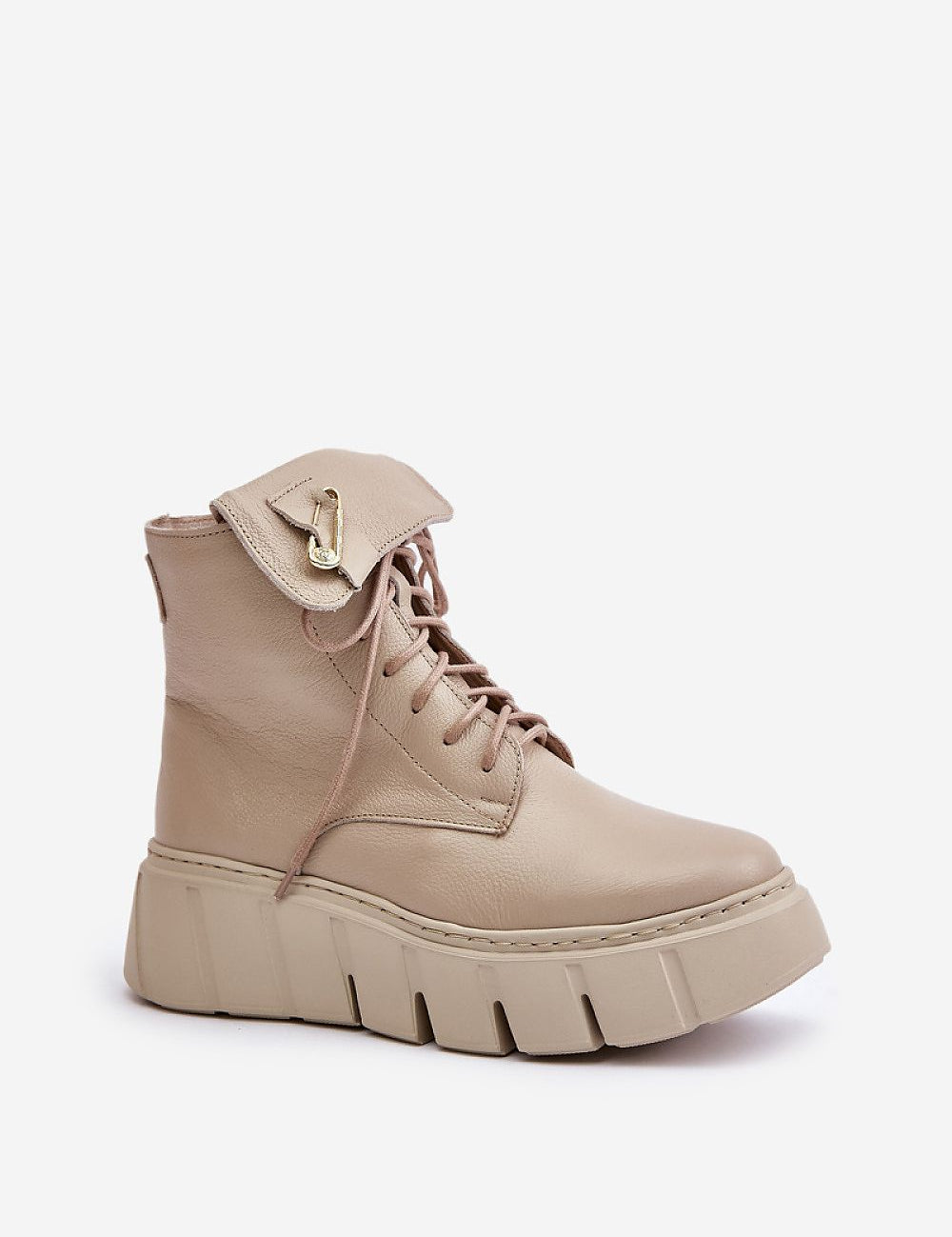 Kaelith leather platform boots with front lacing, side zipper, rounded toes, and safety pin accent for urban edge and winter warmth.