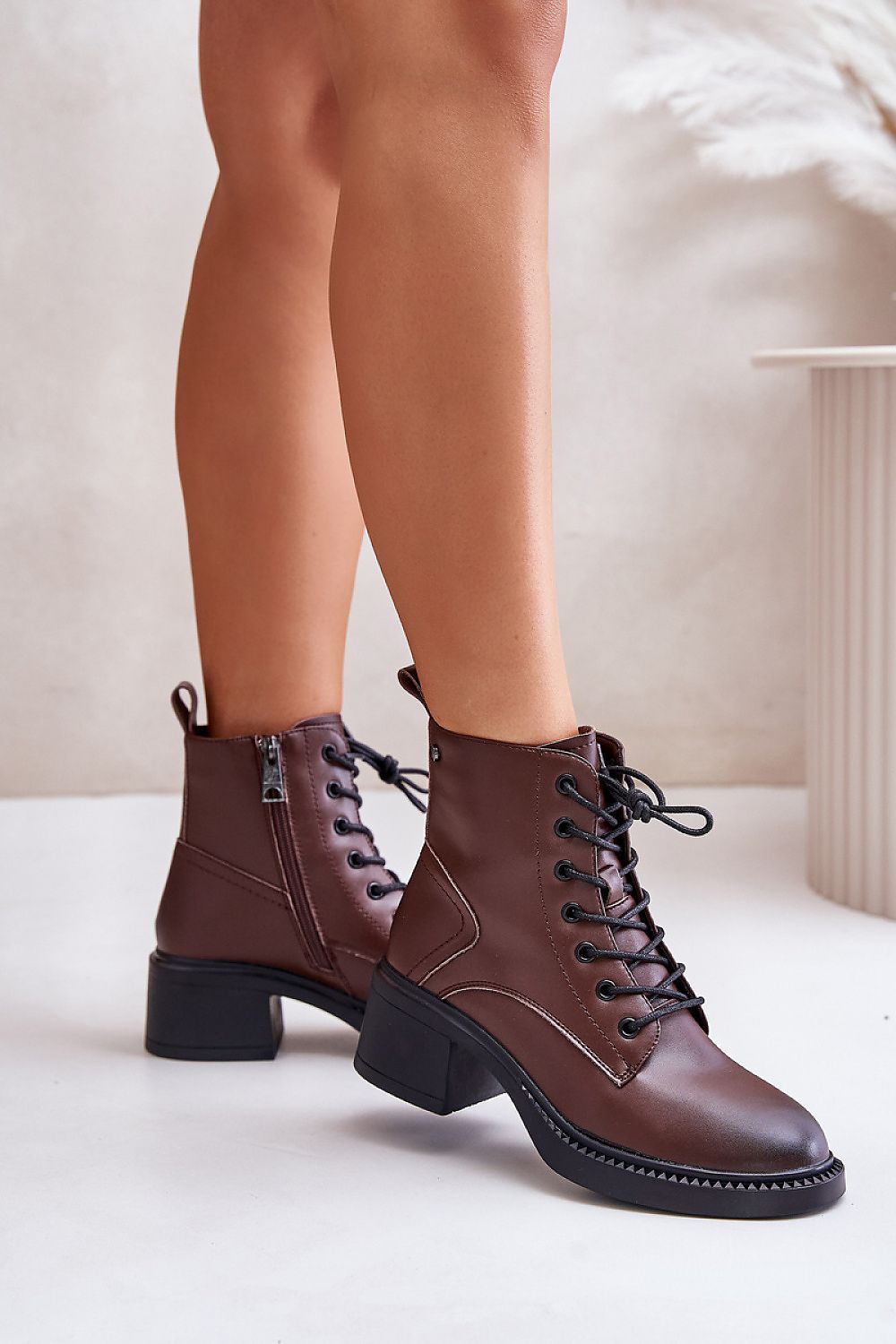 Milvera Leather Lace-Up Heel Boots in brown, featuring ankle-high silhouette with side zipper and laces, styled with block heels.