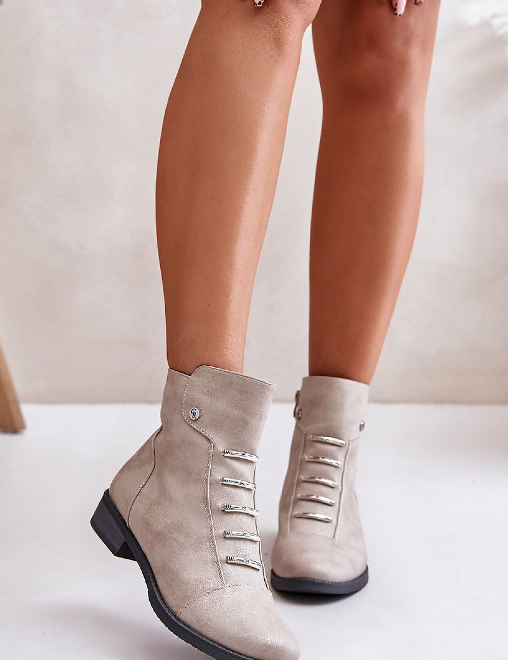 Norelle Minimal Zip Boots in eco leather, with a flat heel and side zipper for warmth and comfort, perfect for cold-weather outings.