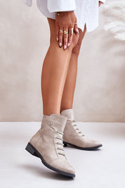 Woman wearing Norelle Minimal Zip Boots in eco leather with flat heel and side zipper, showcasing elegant and warm design for daily comfort.