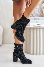 Celvaria embossed suede heel boots with block heel, rounded toe, and side zipper, showcasing textured detail and elegant design.