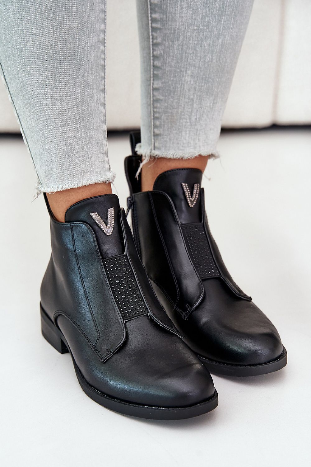Melvaren Zip-Up Ankle Winter Boots in black eco leather with decorative detail, side zippers, rounded toe, and 3 cm heel.