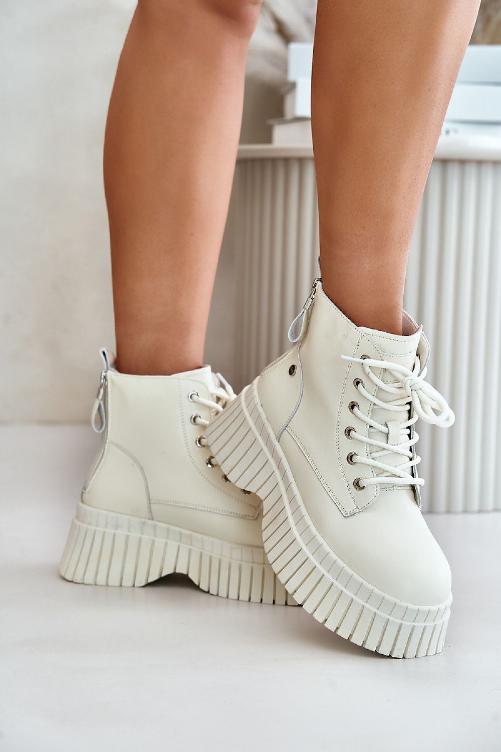 Tavareen Griptrail insulated trapper boots in natural leather with thick platform soles for traction and a secure fit.